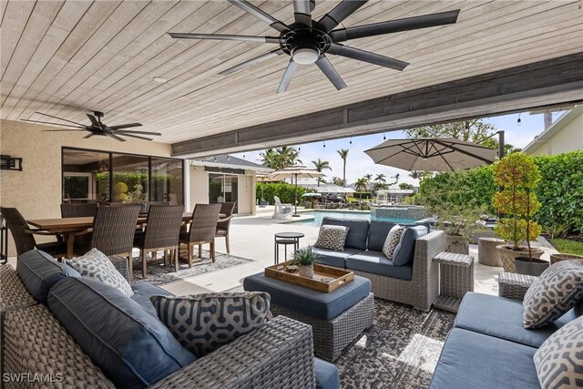 1020 SW 56th St, Cape Coral, FL 33914 - view of patio featuring outdoor lounge area, a ceiling fan, outdoor dining area, and a pool with connected hot tub