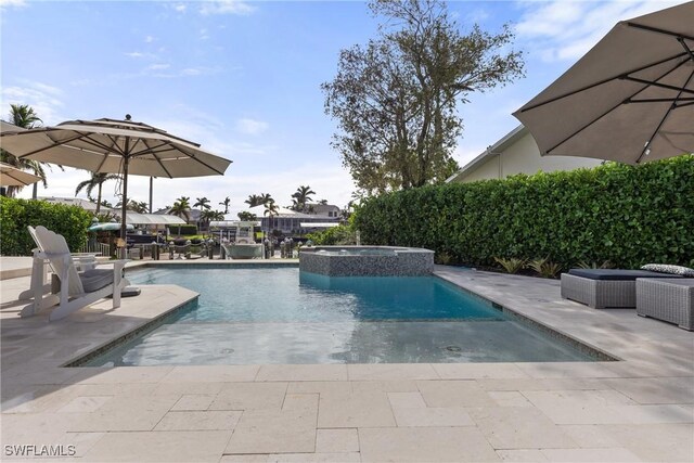 1020 SW 56th St, Cape Coral, FL 33914 - view of pool featuring a patio and a pool with connected hot tub