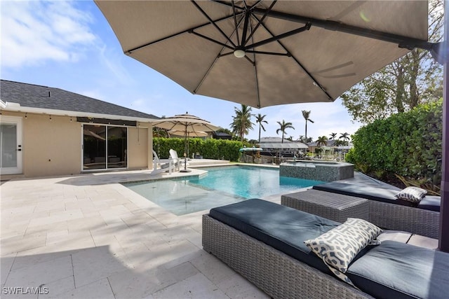 1020 SW 56th St, Cape Coral, FL 33914 - view of pool featuring a patio and a pool with connected hot tub