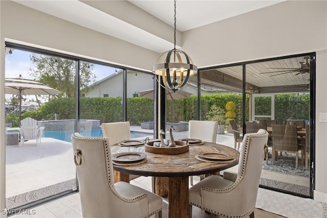 1020 SW 56th St, Cape Coral, FL 33914 - tiled dining room with a chandelier and healthy amount of natural light