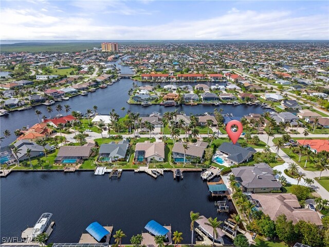 1020 SW 56th St, Cape Coral, FL 33914 - aerial overview of property's location featuring nearby suburban area and a nearby body of water