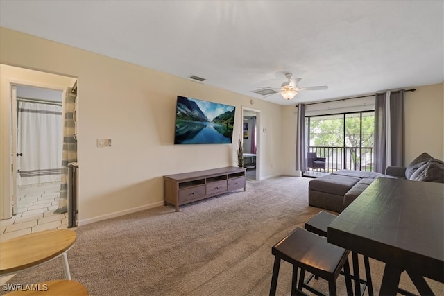 503 Cape Coral Pkwy W Unit 201, Cape Coral, FL 33914 - carpeted living room featuring ceiling fan and baseboards