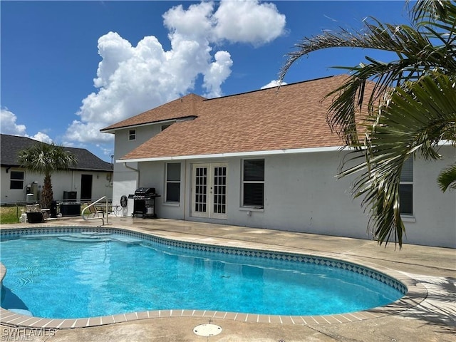 23 NW 22nd Ave, Cape Coral, FL 33993 - swimming pool featuring french doors, a patio area, and grilling area