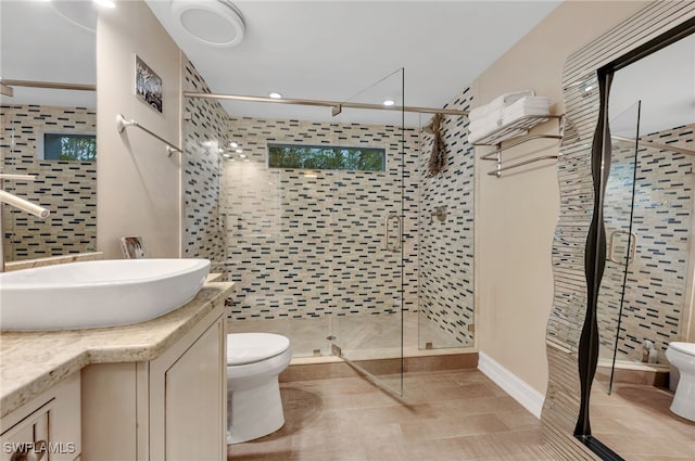 2347 Coach House Ln, Naples, FL 34105 - bathroom featuring toilet, vanity, a shower stall, recessed lighting, and tile patterned floors
