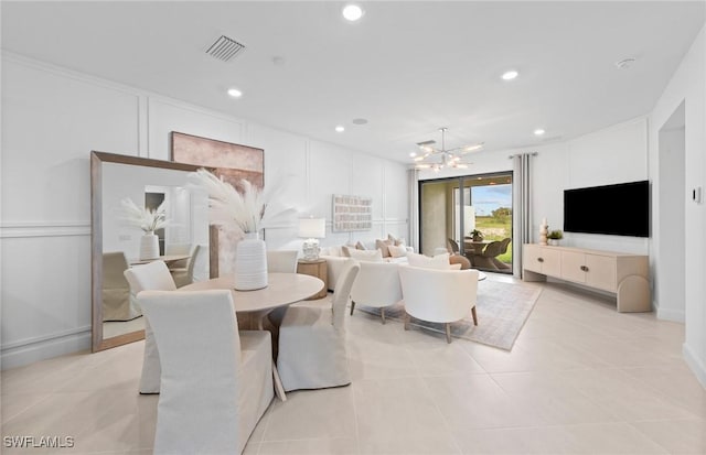 6470 Memorial Ln, Ave Maria, FL 34142 - dining room featuring a chandelier, recessed lighting, and light tile patterned floors