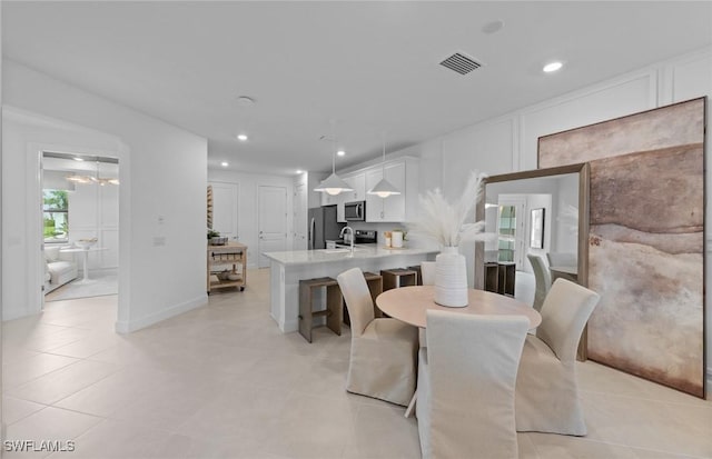 6470 Memorial Ln, Ave Maria, FL 34142 - dining room featuring recessed lighting and light tile patterned floors