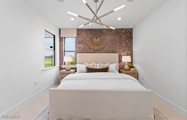 6470 Memorial Ln, Ave Maria, FL 34142 - bedroom with a chandelier, baseboards, an accent wall, and recessed lighting