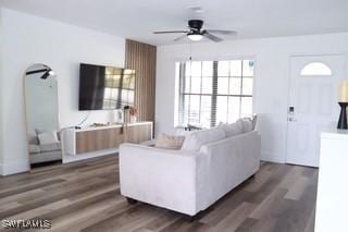 5750 N Andrews Ave, Oakland Park, FL 33309 - living area featuring ceiling fan and dark wood-style floors