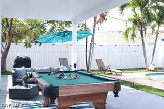 5750 N Andrews Ave, Oakland Park, FL 33309 - fenced backyard featuring a patio area