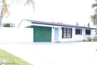 5750 N Andrews Ave, Oakland Park, FL 33309 - view of front of property featuring driveway