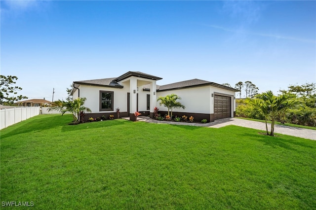 1925 NW 30th Ter, Cape Coral, FL 33993 - view of front of property featuring driveway, an attached garage, and stucco siding