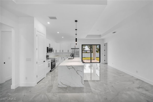1925 NW 30th Ter, Cape Coral, FL 33993 - kitchen featuring appliances with stainless steel finishes, baseboards, a sink, white cabinetry, and recessed lighting