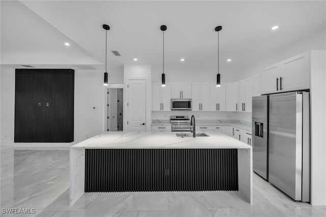 1925 NW 30th Ter, Cape Coral, FL 33993 - kitchen featuring appliances with stainless steel finishes, light marble finish floors, a sink, white cabinets, and recessed lighting