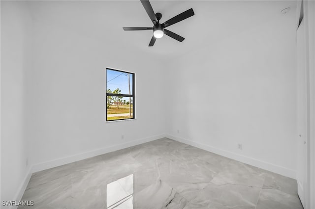 1925 NW 30th Ter, Cape Coral, FL 33993 - empty room with a ceiling fan, baseboards, and light marble finish floors