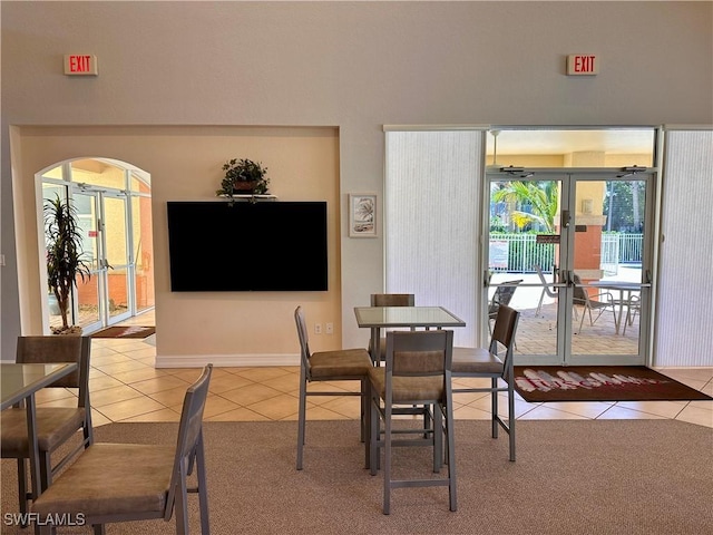 6401 Aragon Way Unit 102, Fort Myers, FL 33966 - dining room with light tile patterned flooring and light carpet