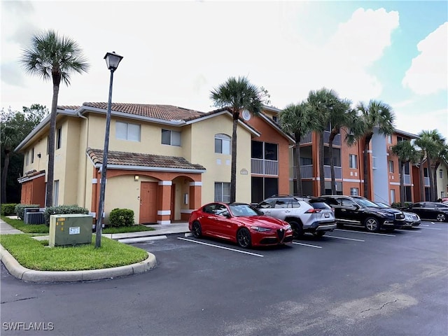 6401 Aragon Way Unit 102, Fort Myers, FL 33966 - view of property featuring uncovered parking