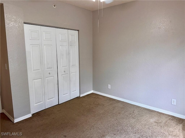 6401 Aragon Way Unit 102, Fort Myers, FL 33966 - unfurnished bedroom with carpet floors, a closet, and baseboards