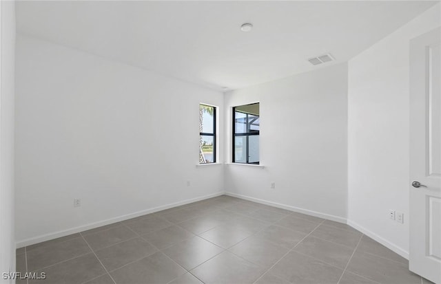6459 Memorial Ln, Ave Maria, FL 34142 - unfurnished room featuring tile patterned floors and baseboards