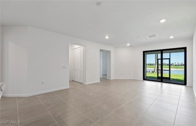 6459 Memorial Ln, Ave Maria, FL 34142 - spare room featuring light tile patterned floors, recessed lighting, and baseboards