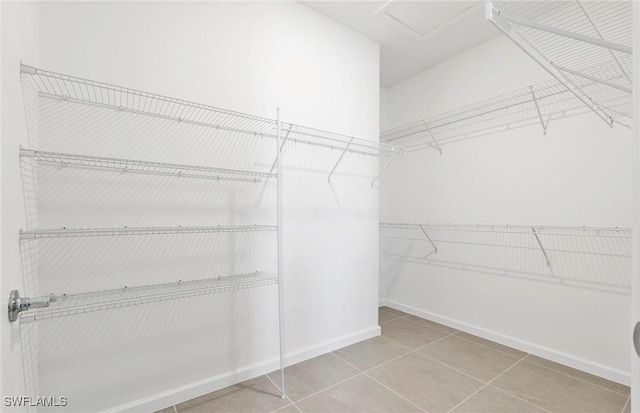 6459 Memorial Ln, Ave Maria, FL 34142 - spacious closet featuring tile patterned floors