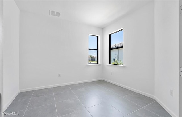 6459 Memorial Ln, Ave Maria, FL 34142 - unfurnished room featuring tile patterned floors and baseboards