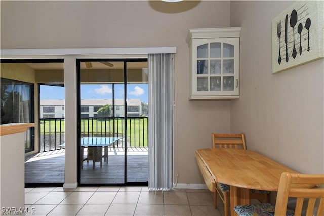 17260 Eagle Trce Unit 10, Fort Myers, FL 33908 - doorway to outside with baseboards and light tile patterned flooring