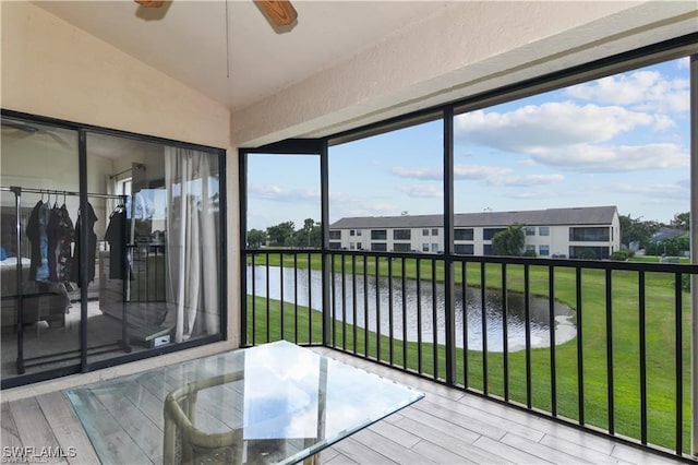 17260 Eagle Trce Unit 10, Fort Myers, FL 33908 - sunroom / solarium featuring a water view, vaulted ceiling, and plenty of natural light
