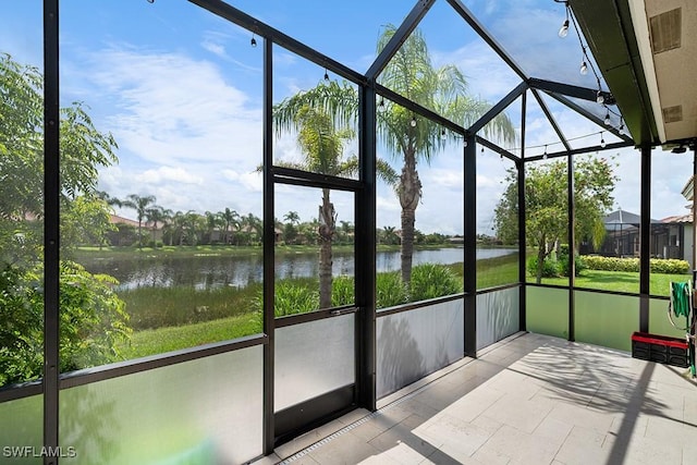 11651 Oakwood Preserve Pl, Fort Myers, FL 33913 - unfurnished sunroom with a water view and plenty of natural light
