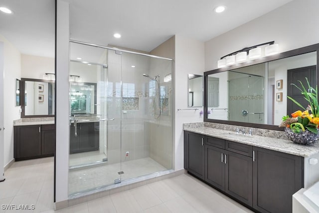 11651 Oakwood Preserve Pl, Fort Myers, FL 33913 - full bathroom featuring a stall shower, vanity, tile patterned floors, and recessed lighting