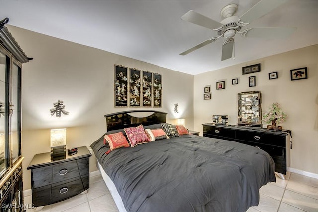 7116 Blanquilla Ct Unit 220, Fort Myers, FL 33908 - bedroom featuring light tile patterned floors, a ceiling fan, and baseboards