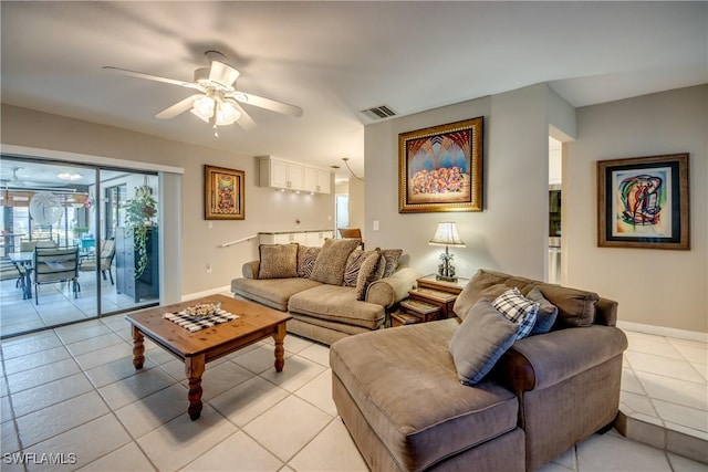 7116 Blanquilla Ct Unit 220, Fort Myers, FL 33908 - living area with light tile patterned floors, a ceiling fan, and baseboards