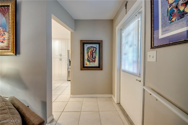 7116 Blanquilla Ct Unit 220, Fort Myers, FL 33908 - hallway featuring light tile patterned floors and baseboards