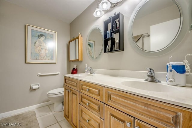 7116 Blanquilla Ct Unit 220, Fort Myers, FL 33908 - full bath with toilet, double vanity, tile patterned floors, and baseboards