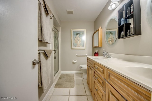 7116 Blanquilla Ct Unit 220, Fort Myers, FL 33908 - bathroom with an enclosed shower, toilet, double vanity, tile patterned flooring, and baseboards