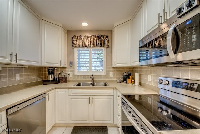 7116 Blanquilla Ct Unit 220, Fort Myers, FL 33908 - kitchen with stainless steel appliances, a sink, and white cabinets