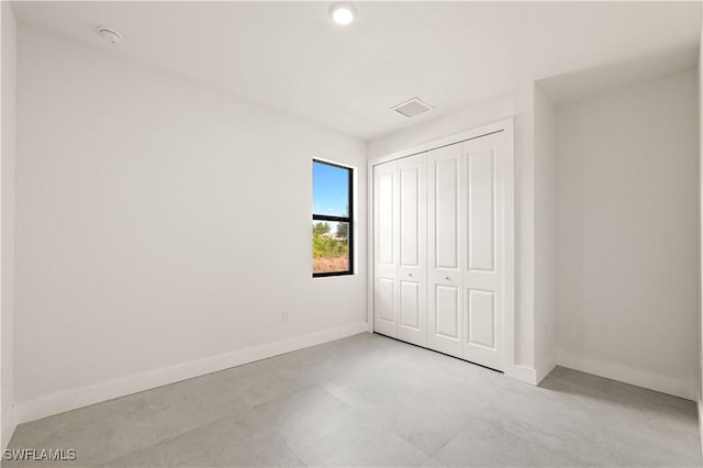 3001 25th St W, Lehigh Acres, FL 33971 - unfurnished bedroom featuring baseboards and a closet