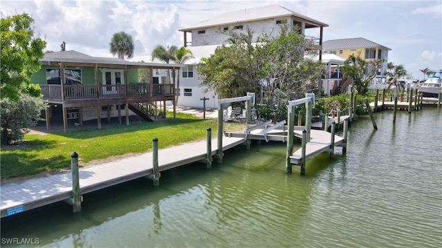 171 Primo Dr, Fort Myers Beach, FL 33931 - dock area with a lawn, a deck with water view, and stairway