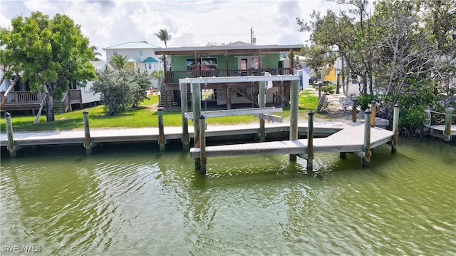 171 Primo Dr, Fort Myers Beach, FL 33931 - dock featuring a water view, stairs, and a lawn
