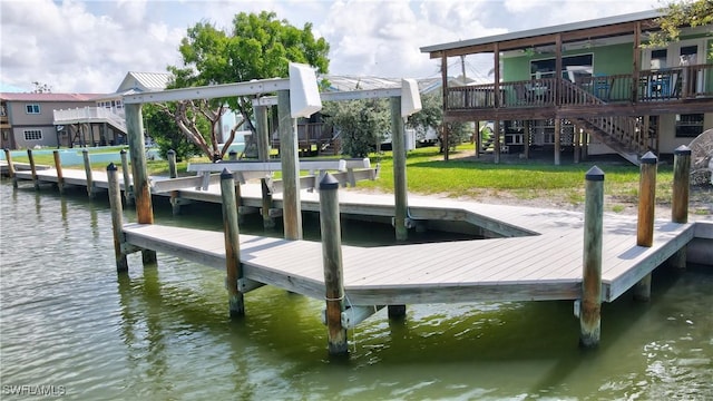 171 Primo Dr, Fort Myers Beach, FL 33931 - dock with stairway, a water view, and a yard
