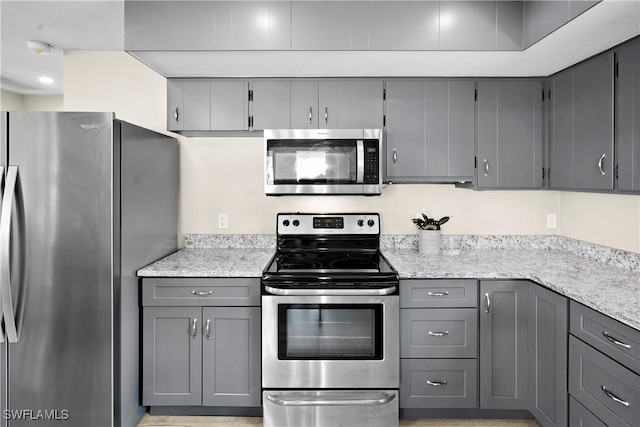 171 Primo Dr, Fort Myers Beach, FL 33931 - kitchen with stainless steel appliances and gray cabinets
