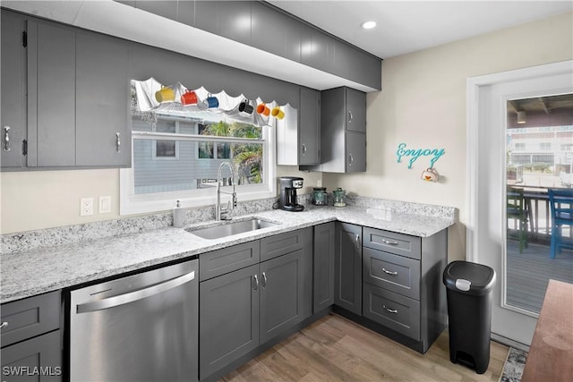 171 Primo Dr, Fort Myers Beach, FL 33931 - kitchen with stainless steel dishwasher, a sink, light wood-type flooring, gray cabinetry, and recessed lighting