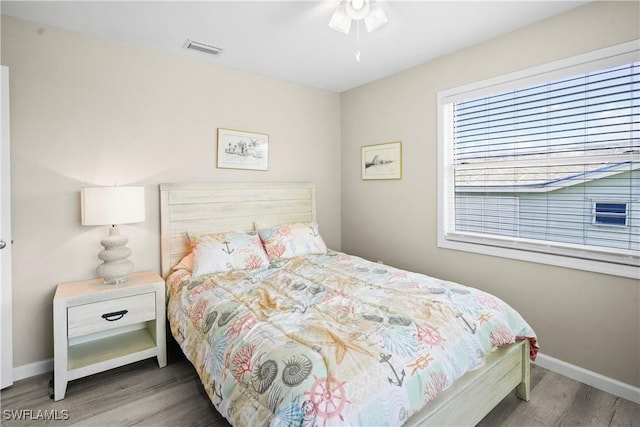 171 Primo Dr, Fort Myers Beach, FL 33931 - bedroom with wood finished floors and baseboards