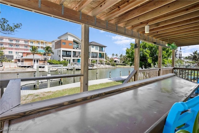 171 Primo Dr, Fort Myers Beach, FL 33931 - view of patio / terrace featuring a water view and a boat dock
