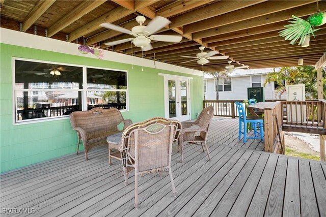171 Primo Dr, Fort Myers Beach, FL 33931 - deck featuring outdoor dining area, french doors, and a ceiling fan