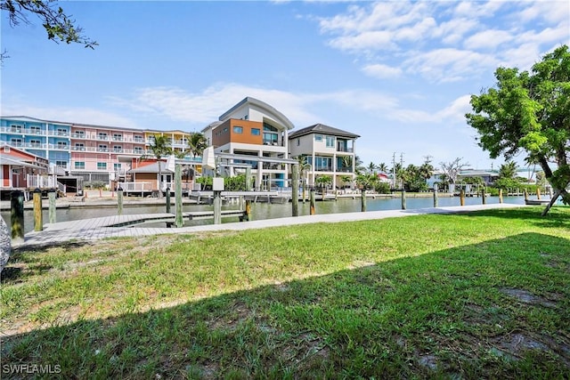 171 Primo Dr, Fort Myers Beach, FL 33931 - view of property's community with a lawn and a water view