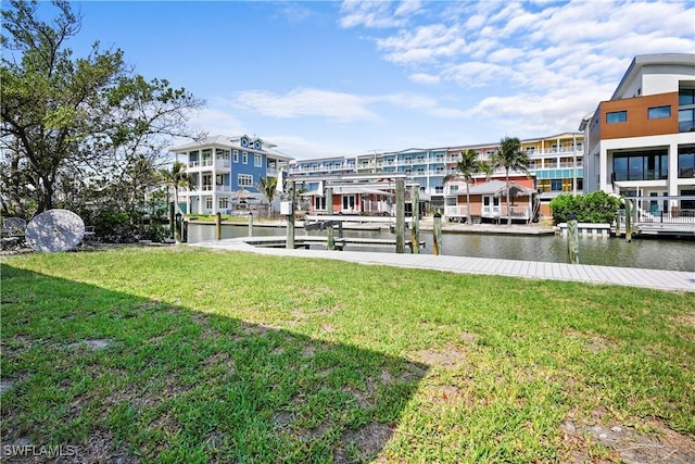 171 Primo Dr, Fort Myers Beach, FL 33931 - dock area featuring a lawn, a water view, and boat lift