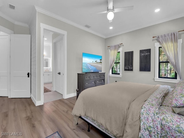 16970 Laurelin Ct, North Fort Myers, FL 33917 - bedroom featuring wood finished floors, baseboards, ornamental molding, recessed lighting, and ensuite bath