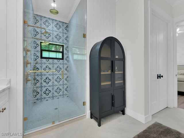 16970 Laurelin Ct, North Fort Myers, FL 33917 - bathroom with ornamental molding, a shower stall, vanity, and baseboards