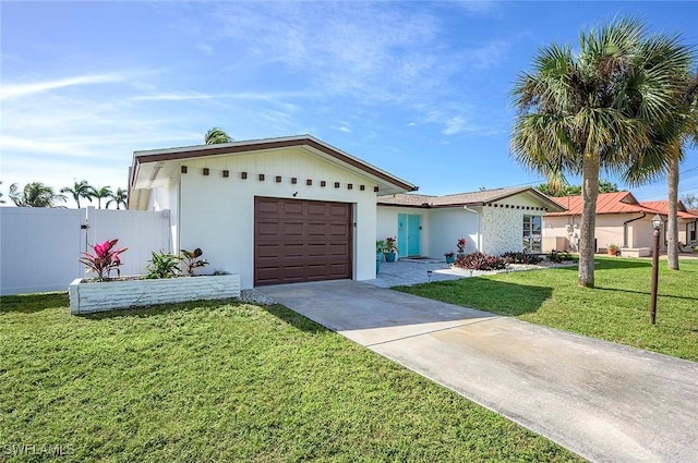 1432 Wellington Ct, Cape Coral, FL 33904 - view of front of home with concrete driveway, a garage, and stucco siding