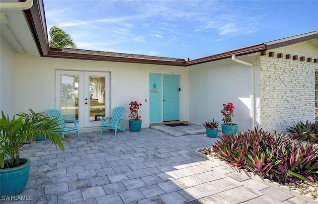 1432 Wellington Ct, Cape Coral, FL 33904 - view of patio / terrace featuring french doors